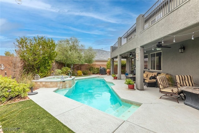 view of swimming pool with ceiling fan, an outdoor hangout area, an in ground hot tub, and a patio