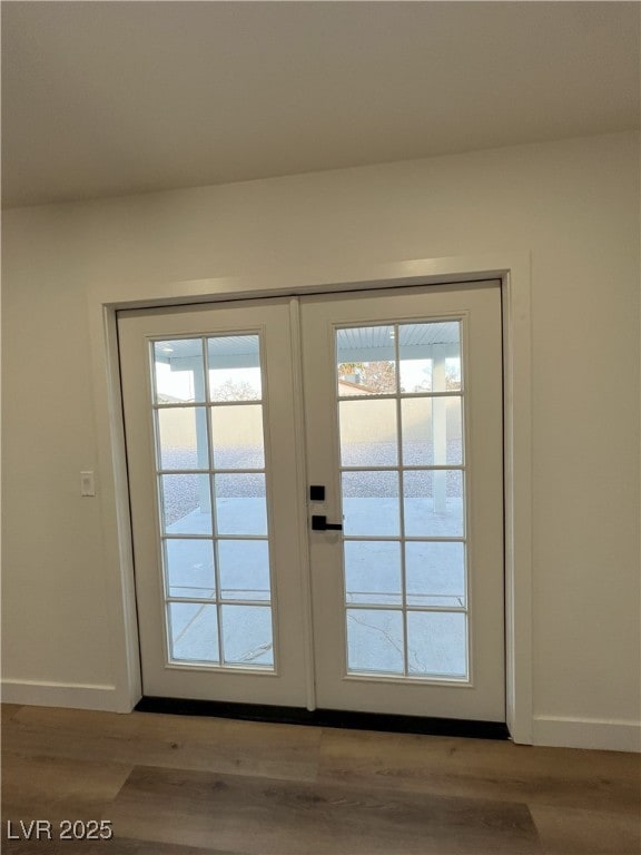 doorway featuring french doors, light hardwood / wood-style floors, and plenty of natural light