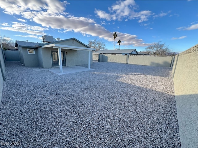 back of house featuring central air condition unit and a patio