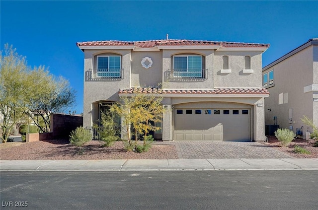 mediterranean / spanish-style home featuring a garage