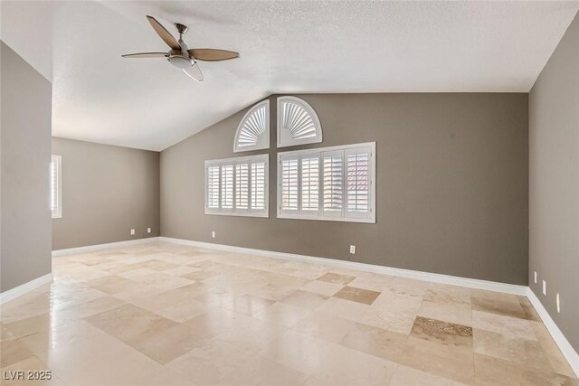 spare room featuring ceiling fan, a textured ceiling, and vaulted ceiling