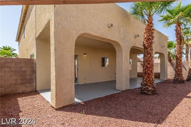 back of house with a patio area