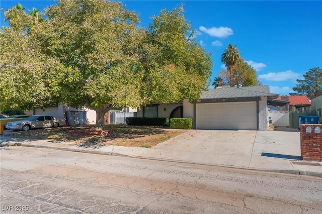 obstructed view of property with a garage