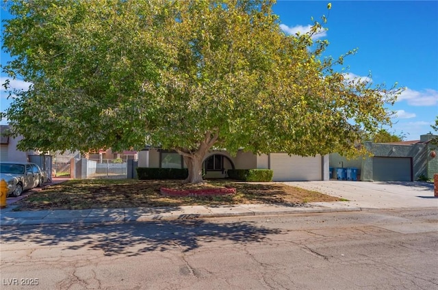 obstructed view of property with a garage