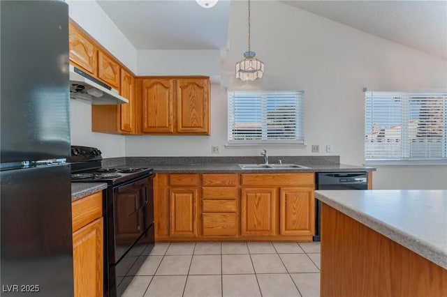 kitchen featuring a wealth of natural light, sink, black appliances, pendant lighting, and light tile patterned flooring