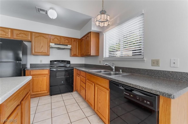 kitchen featuring hanging light fixtures, sink, light tile patterned floors, and black appliances