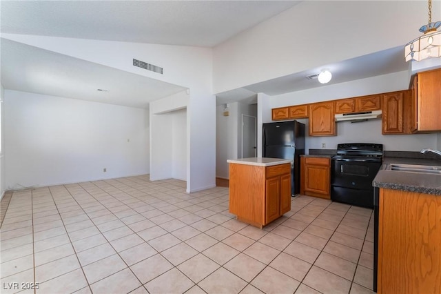 kitchen featuring light tile patterned flooring, black appliances, sink, vaulted ceiling, and a kitchen island