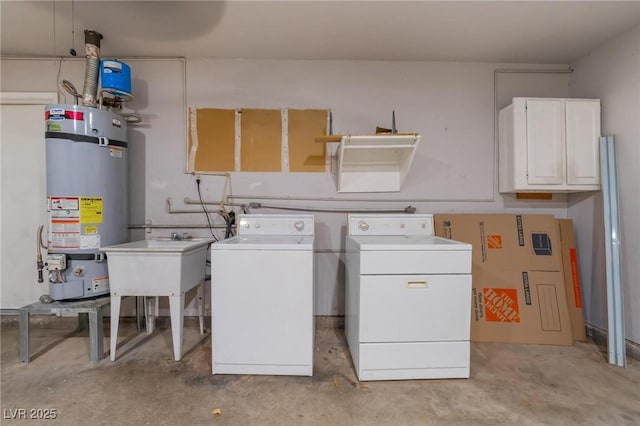 laundry room featuring washer and clothes dryer, cabinets, sink, and water heater