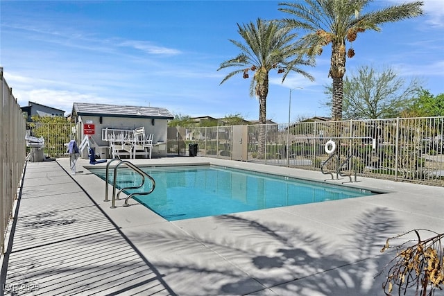 view of swimming pool with a patio area