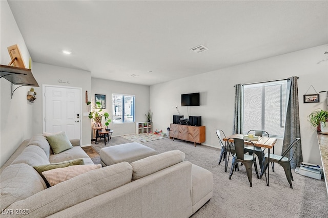 living room featuring light carpet