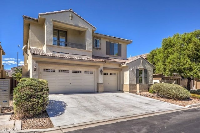 mediterranean / spanish house with a garage