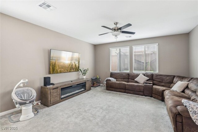 carpeted living room featuring ceiling fan