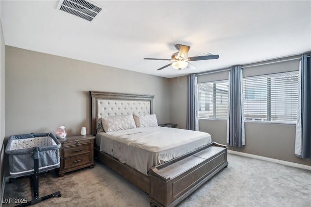 bedroom with light carpet and ceiling fan