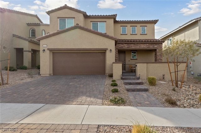 mediterranean / spanish-style home featuring a garage