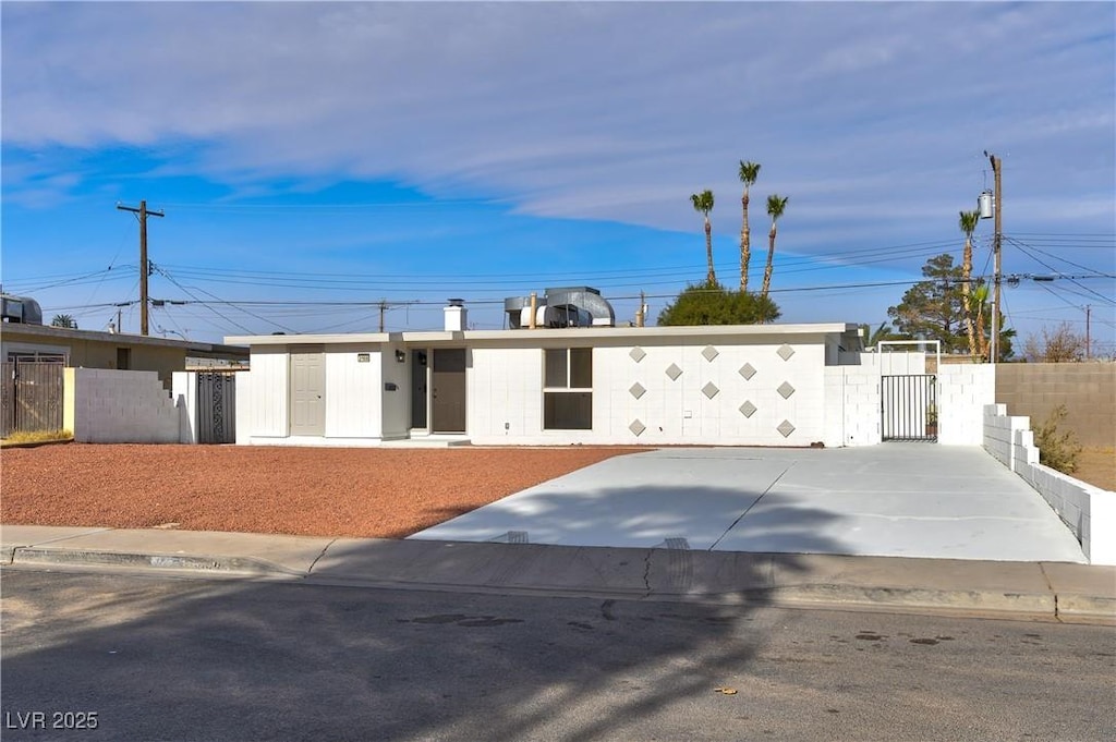 single story home with fence