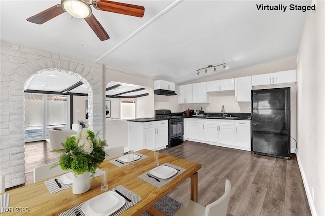 kitchen with sink, white cabinetry, a wealth of natural light, and black appliances