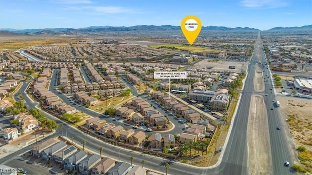 birds eye view of property featuring a mountain view