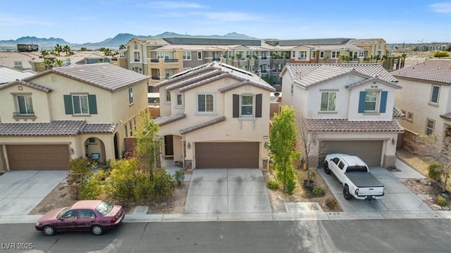 view of front of home featuring a mountain view and a garage