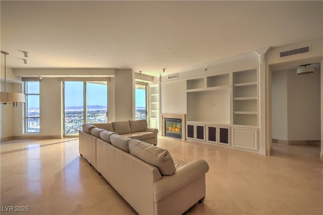 living room featuring built in shelves