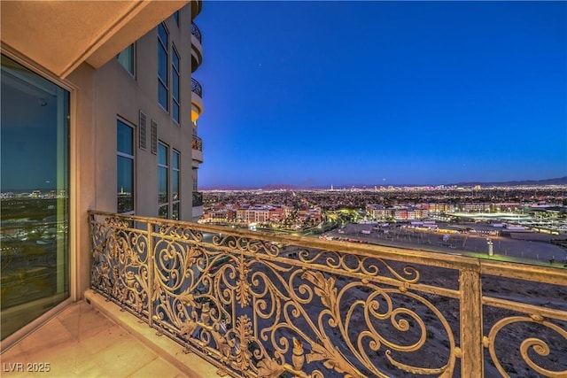 view of balcony at dusk