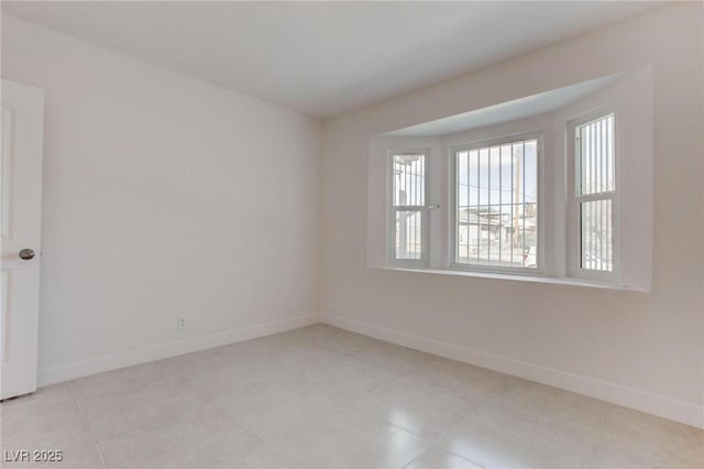 view of tiled spare room