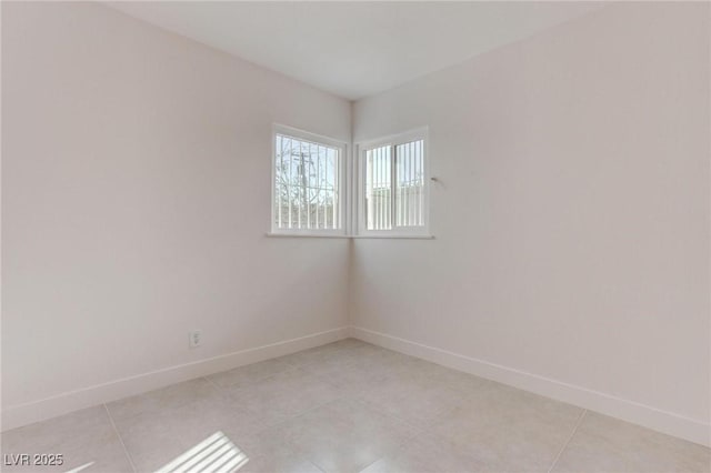 empty room featuring light tile patterned flooring