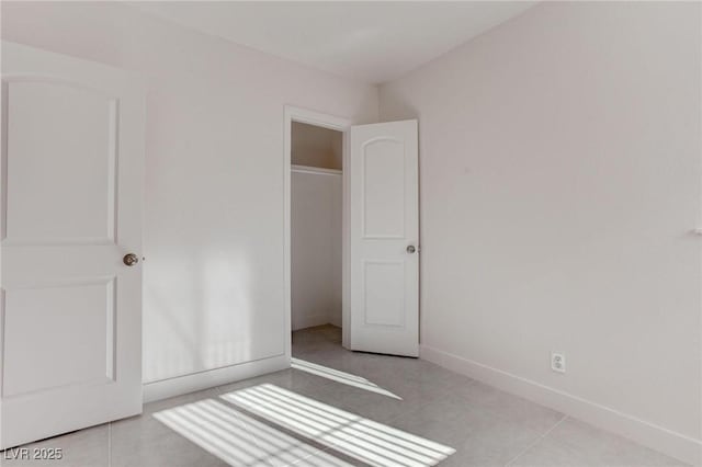 unfurnished bedroom with light tile patterned floors