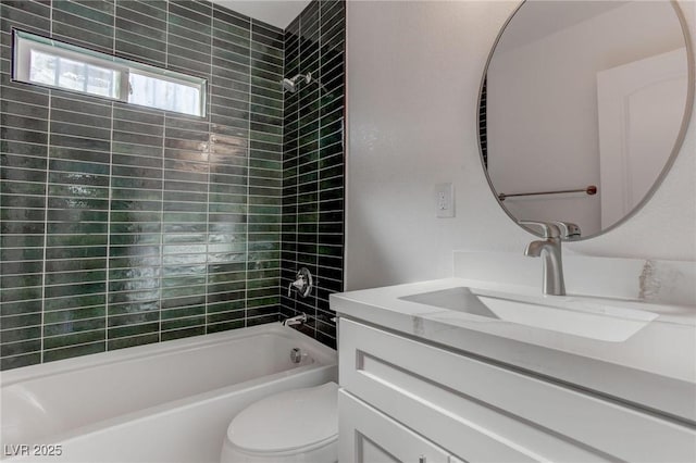 full bathroom with vanity, washtub / shower combination, and toilet