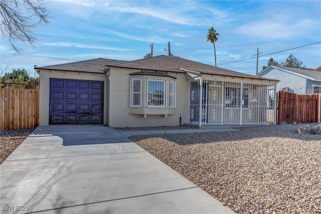 single story home featuring a garage