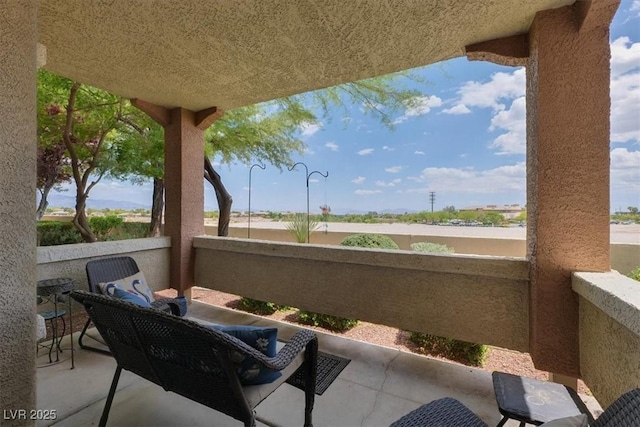 view of patio / terrace with a balcony