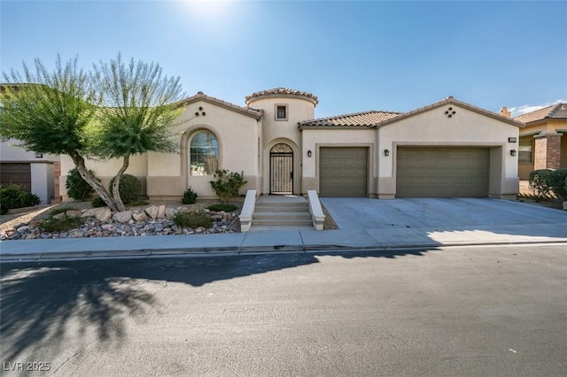 mediterranean / spanish-style home featuring a garage