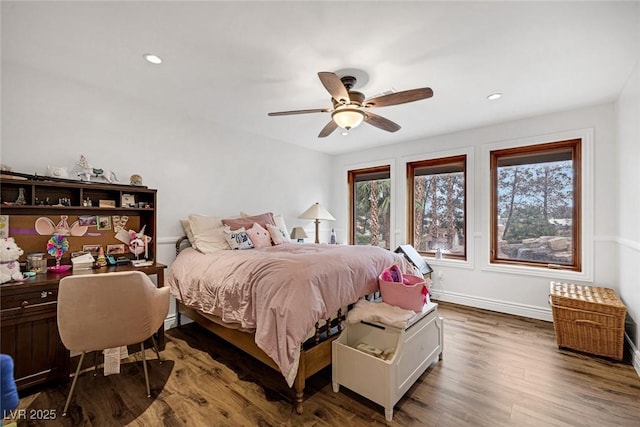 bedroom featuring ceiling fan and dark wood-type flooring