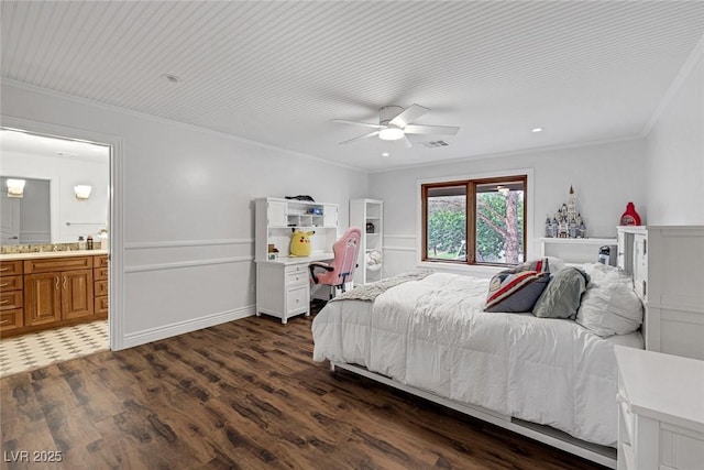 bedroom with ceiling fan, crown molding, ensuite bathroom, and dark wood-type flooring