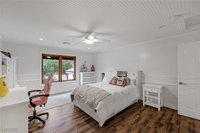 bedroom featuring ceiling fan, dark hardwood / wood-style flooring, and ornamental molding