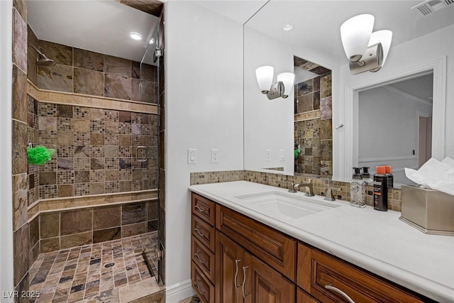 bathroom featuring vanity and a tile shower