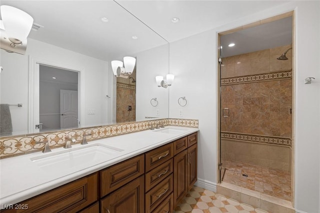 bathroom with vanity and a shower with shower door