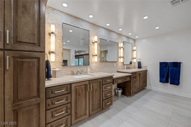 bathroom featuring decorative backsplash and vanity