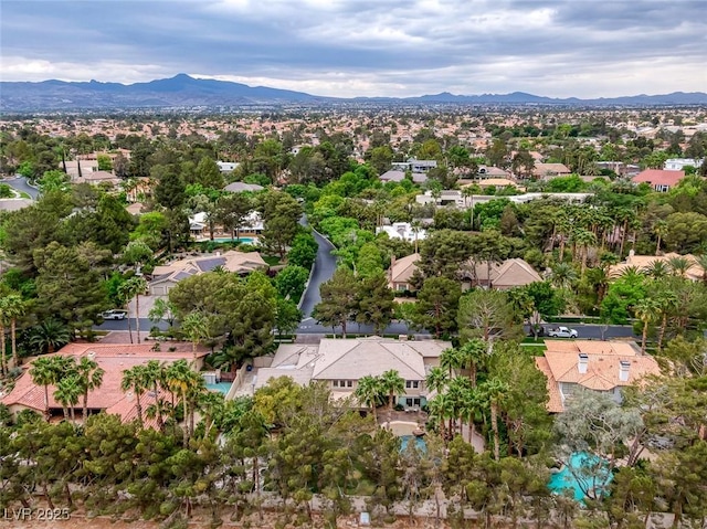 birds eye view of property featuring a mountain view