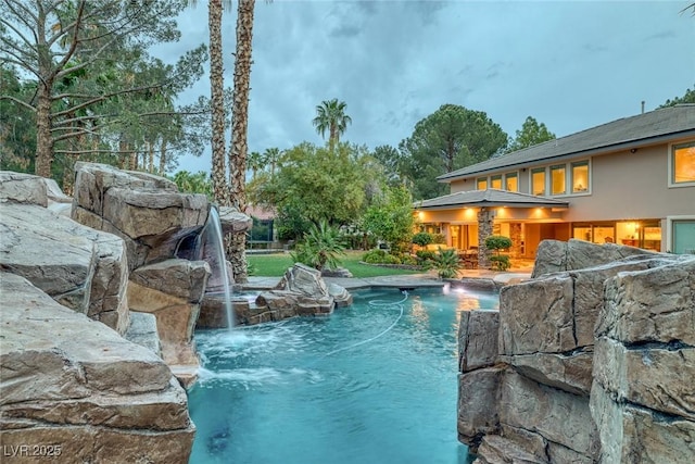 view of pool featuring pool water feature