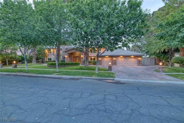 view of front facade with a front yard and a garage