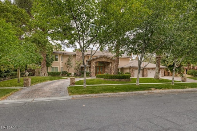 view of front facade with a front lawn and a garage