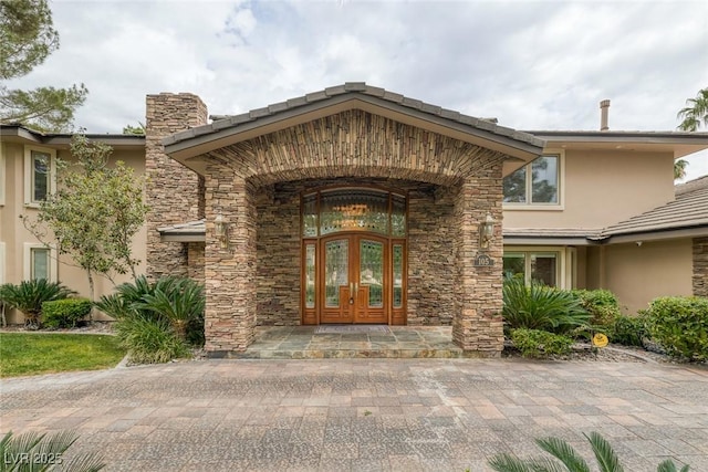 entrance to property featuring french doors