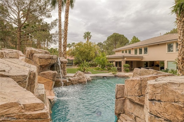 view of pool featuring pool water feature