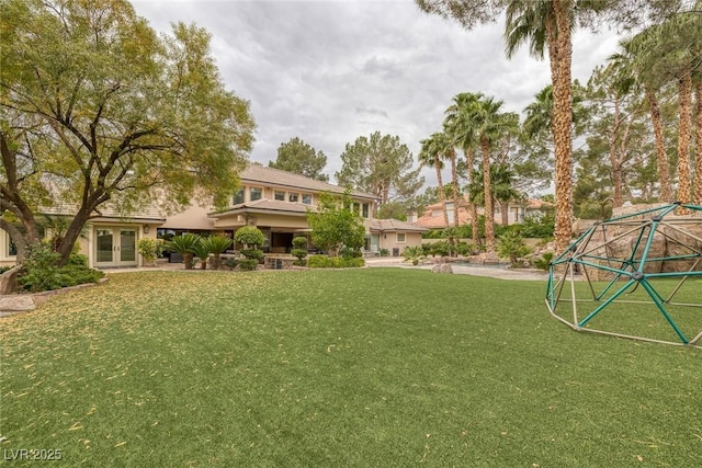 view of yard with french doors