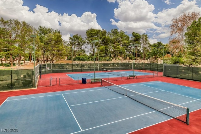 view of tennis court with basketball hoop