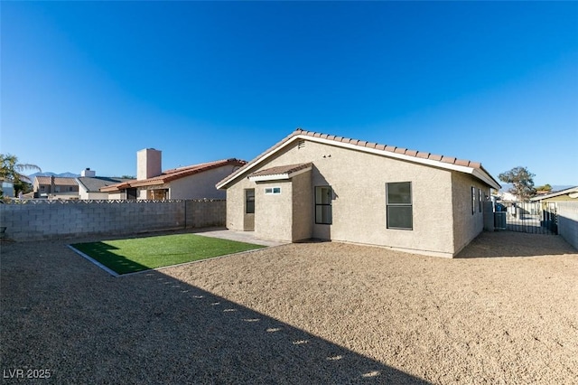 back of property featuring a patio area