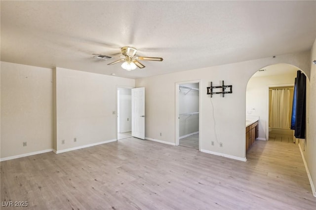 unfurnished room with ceiling fan and light hardwood / wood-style flooring