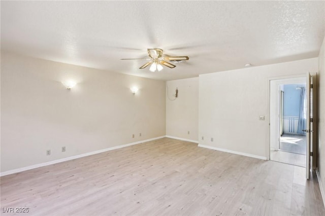 unfurnished room featuring light wood-type flooring, ceiling fan, and a textured ceiling