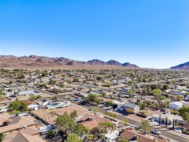 birds eye view of property featuring a mountain view