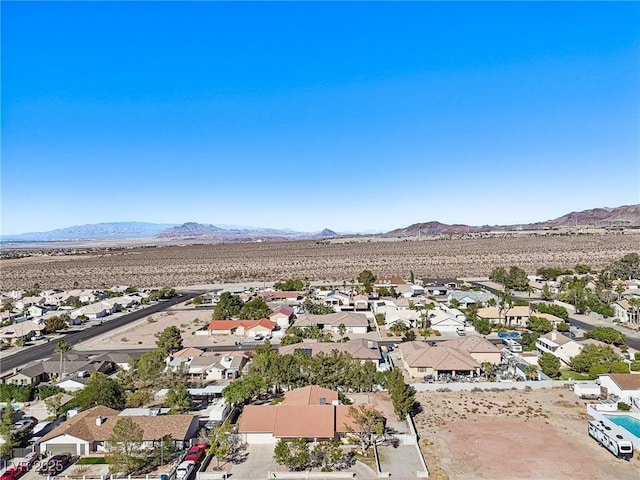 birds eye view of property featuring a mountain view